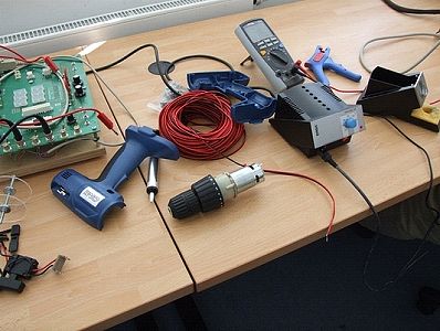 Disassembled battery powered screwdriver on the bench