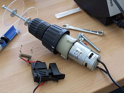 A cable reel replaces more conventional bits on the screwdriver