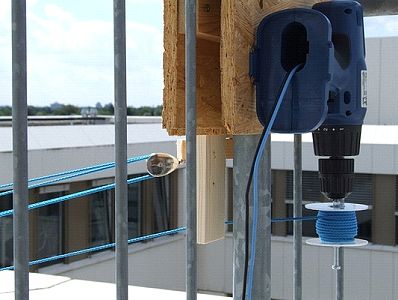 Rear view of screwdriver attached to railing mount plate