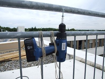 Detail of screwdriver lashed to railing for test