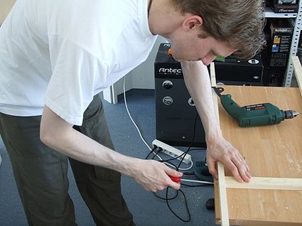 Screwing the solar panel framework together
