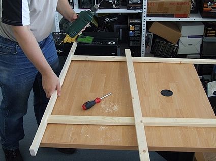 Assembling the solar panel framework.