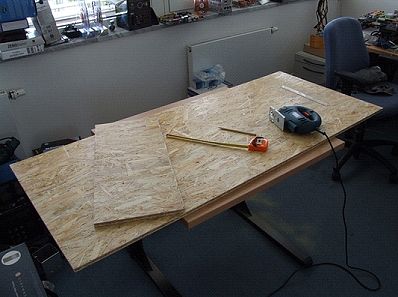 Shorter panel goes on top and supports the solar panel framework.