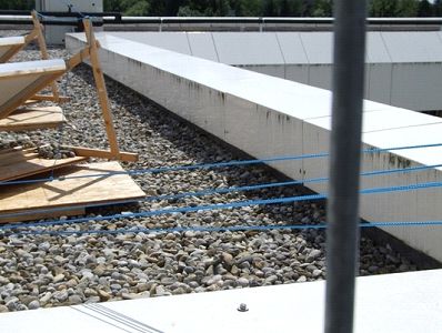 The cabling stretches from the pulley to the nearest platform