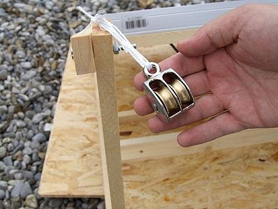 Double brass pulley attached to solar array framework